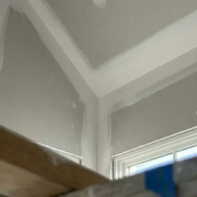Finished drywall corners and ceiling line ready for primer in Elgin, IL